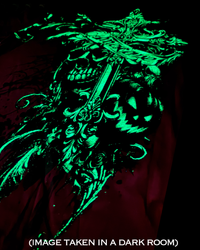 A RED garment featuring a large, glowing neon green graphic of a skull wearing a crown, overlaid with the text '(IMAGE TAKEN IN A DARK ROOM)'.